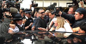 The file photo taken on November 1, 1993 in London, shows British pop superstar George Michael arriving at the high court during his attempt to break from his record company Sony.