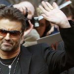 British singer and actor George Michael waves as he leaves a news conference to introduce the film George Michael: A Different Story by Southan Morris which is not part of the competition at the 55th Berlinale International Film Festival in Berlin February 16, 2005.