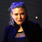 Carrie Fisher poses for cameras as she arrives at the European Premiere of ‘Star Wars, The Force Awakens’ in Leicester Square, London, on December 16, 2015.