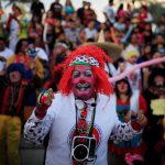 Clowns participate in a show during Salvadoran Clown Day celebrations in San Salvador, El Salvador, December 7, 2016