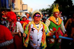 Clowns participate in a show during Salvadoran Clown Day celebrations in San Salvador, El Salvador, December 7