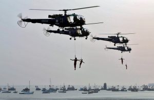 Indian Navy marine commandos demonstrate their skills during the Navy Day celebrations in Mumbai