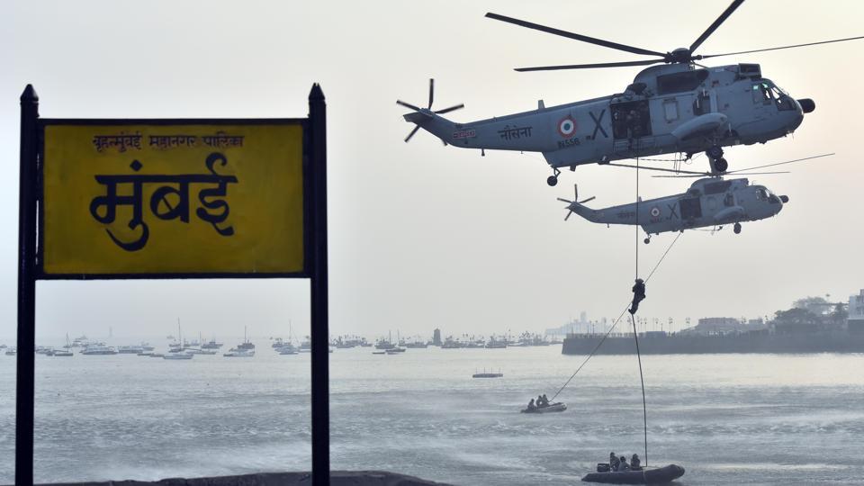 Marine commandos demonstrate rescue operation during Navy Day celebration at Gateway of India