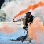 Marine commandos demonstrate rescue operation during Navy Day celebration at Gateway of India