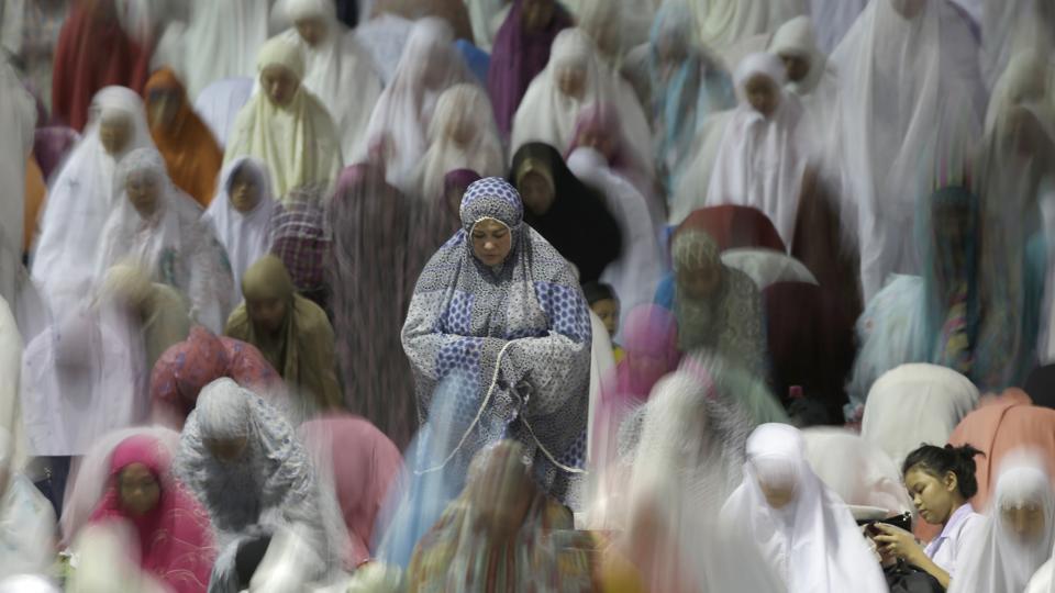 Muslim women perform an evening prayer called 'tarawih' marking the first eve of the holy fasting month of Ramadan, at Istiqlal Mosque in Jakarta, Indonesia.