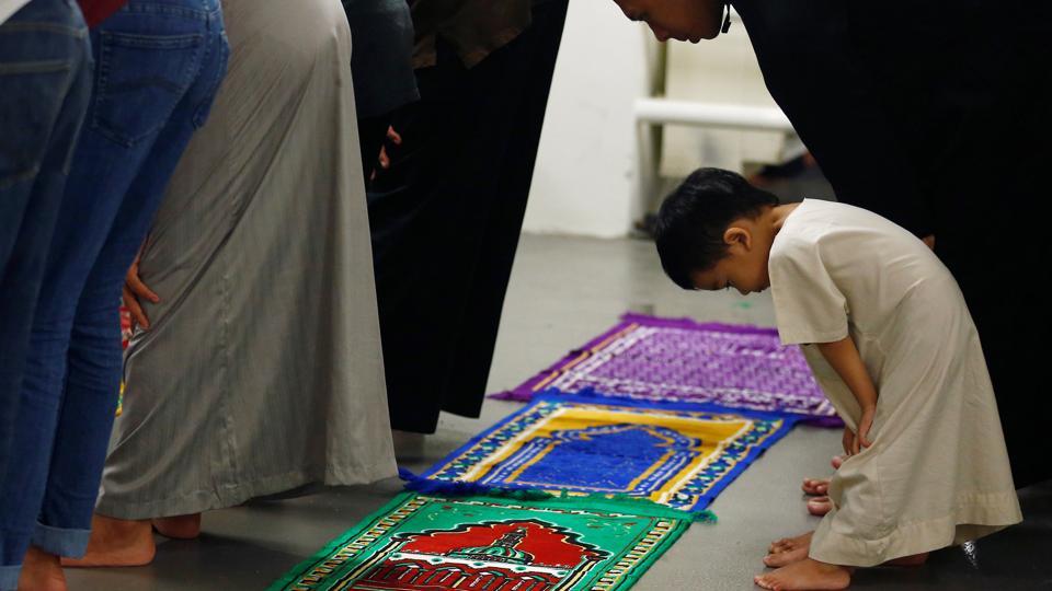 Muslims perform ‘Tarawih’ prayers to mark the start of Ramadan at a mosque in Singapore