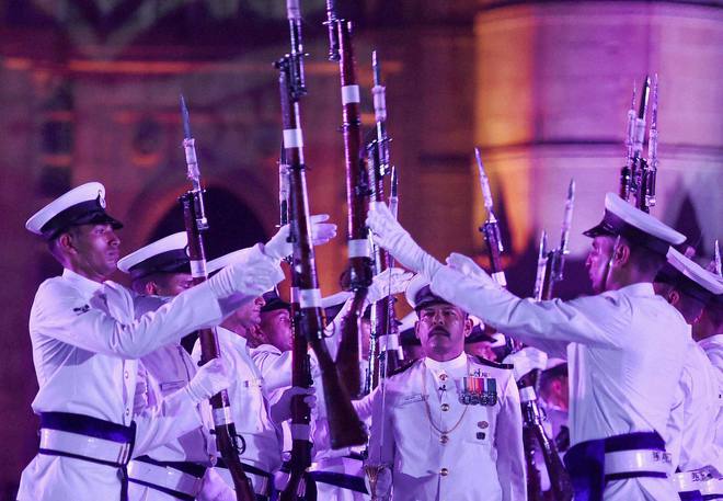Navy personnel perform during the Navy Day celebrations at Gateway of India in Mumbai