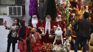People visit Khan Market on Christmas eve to shop in New Delhi