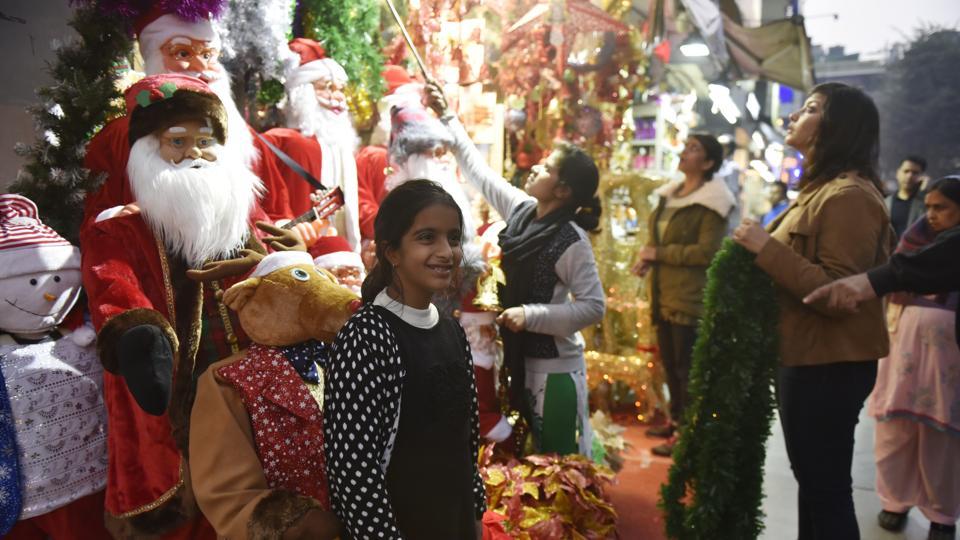 People visit Khan Market on Christmas eve to shop