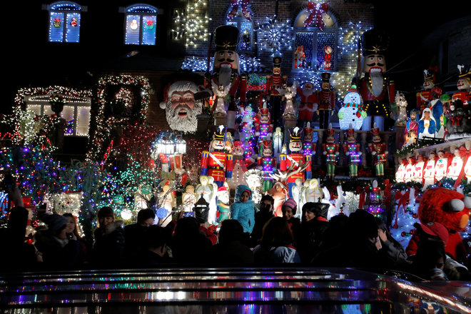 People walk by at the Dyker Heights Christmas Lights in the Dyker Heights neighborhood of Brooklyn, New York City, US, on December 23, 2016.