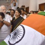 Prime Minister Narendra Modi consoles Tamil Nadu Chief Minister O Panneerselvam after he paid his last respects to former chief minister J. Jayalalithaa at Rajaji Hall in Chennai on December 6, 2016.