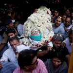 Relatives and friends of Bollywood actor Om Puri carry his body to an ambulance before his funeral in Mumbai, India, on January 6, 2017