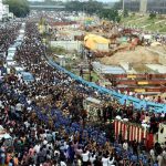 Supporters of Tamil Nadu chief minister J. Jayalalithaa wait for the vehicle carrying her remains during her funeral procession in Chennai, India, on December 6, 2016.