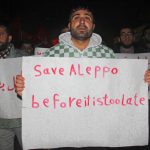 Syrian’s shout slogans during a rally in the rebel-held northwestern city of Idlib, late on December 12, 2016, in support of residents of the rebel-controlled part of Aleppo which is under regime siege.