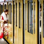 A Japanese woman wearing a kimono gets on a train after the Coming of Age Day celebration ceremony in Tokyo, Japan, on January 9