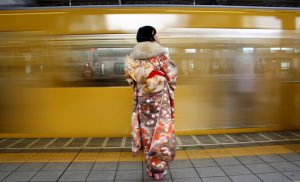 A Japanese woman wearing a kimono waits for her train after Coming of Age Day celebration ceremony in Tokyo, Japan, January 9