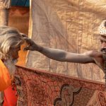 A Naga sadhu gives blessing to a sadhu at Gangasagar transit camp Babughat in Kolkata on Wednessday enroute to Gangasagar mela