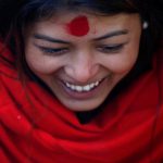 A devotee smiles as she offers prayers during the Swasthani Brata Katha festival in Kathmandu, Nepal, on January 12, 2017