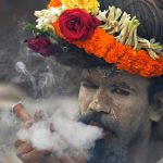 A naga sadhu smokes chillum on the way to Gangasagar mela (festival) at Babughat transit camp in Kolkata, India, on Wednesday, January 11, 2017