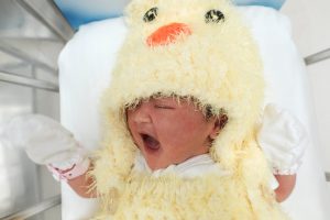 A newborn baby wearing a chicken costume to celebrate the Chinese New Year of the Rooster is pictured at the nursery room of Paolo Chockchai 4 Hospital, in Bangkok, Thailand, on January 27, 2017