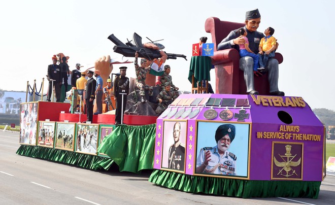 A tableau with a message ‘Veterans always in the service of the Nation’ on display at the 69th Army Day parade in New Delhi