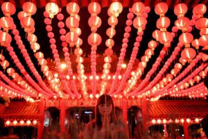 An Ethnic Malaysian-Chinese devotee burns joss-sticks at the Thean Hou temple decorated with red lanterns in Kuala Lumpur on January 27, 2017 on the eve of the Lunar New Year. The Lunar New Year will mark the start of the Year of the Rooster on January 28