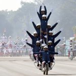 Army daredevils displaying their riding skills on motorcycles during the 69th Army Day parade in New Delhi