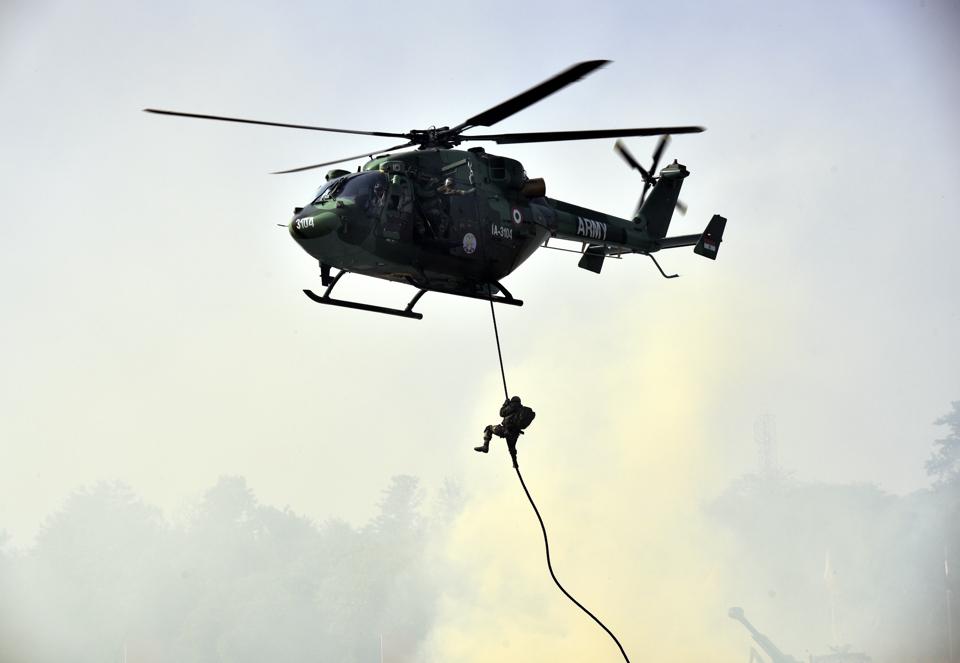 Army soldiers demonstrate their war skills during the Army Day parade at Delhi Cantt in New Delhi