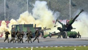 Army soldiers display their war skills during the Army Day parade at Delhi Cantt in New Delhi