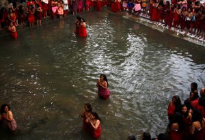 Devotees gather at Saali river during the Swasthani Brata Katha festival at Sankhu in Kathmandu, Nepal, on January 12.