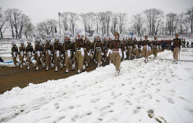 Policewomen march during the 68th Republic Day parade at Bakshi Stadium in Srinagar