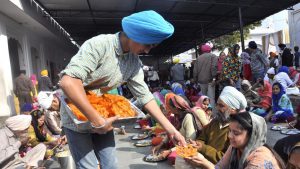 Sant Arora Guru Ka Langar, a public food service, at the Nada Sahib Gurudwara on the Prakash Parva