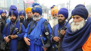 Sikh devotees participate in a Nagar Kirtan, a religious procession taken out on Prakash Parva