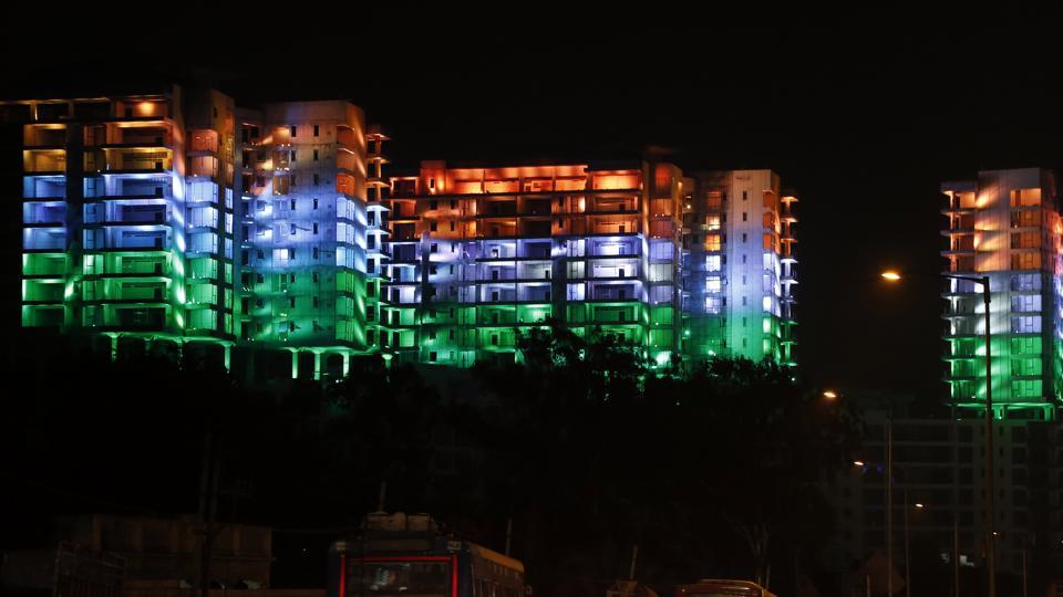 Under-construction buildings lit up in the colours of the Indian flag on the eve of Republic Day in Bangalore