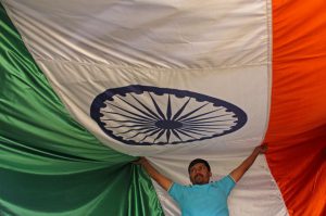 Workers inspect the Tricolour at a workshop ahead of Republic Day at Vasai in Mumbai
