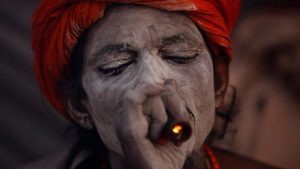 A Hindu holy man, or sadhu, smokes marijuana at the premises of Pashupatinath Temple during the Shivaratri festival in Kathmandu, Nepal February 24, 2017