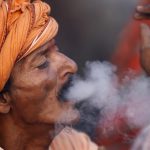 A Hindu holy man, or sadhu, smokes marijuana at the premises of Pashupatinath Temple on the eve of Shivaratri festival in Kathmandu, Nepal February 23, 2017