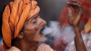A Hindu holy man, or sadhu, smokes marijuana at the premises of Pashupatinath Temple on the eve of Shivaratri festival in Kathmandu, Nepal February 23, 2017