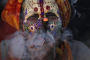 A Hindu holy man smokes marijuana at the courtyard of the Pashupatinath temple during Shivaratri festival in Kathmandu, Nepal, Friday, Feb. 24, 2017. Shivaratri, or the night of Shiva, is dedicated to the worship of Lord Shiva, the Hindu god of death and destruction