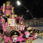 Dancers from the Tom Maior samba school perform on a float during a carnival parade in Sao Paulo, Brazil