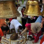 Devotees offer milk in temple during Maha Shivratri festival, in Jammu