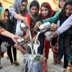 Devotees on the occasion of Maha Shivratri offering milk at a temple in sector 21 in Chandigarh