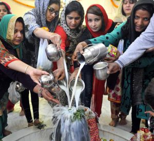 Devotees on the occasion of Maha Shivratri offering milk at a temple in sector 21 in Chandigarh