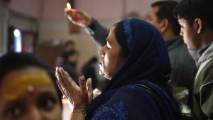 Devouts chant prayers as they throng a temple complex for blessings