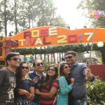 People taking a selfie at the entrance of the garden