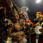 Revellers parade for the Mocidade Alegre samba school during the carnival in Sao Paulo, Brazil