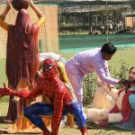 Workers cleaning up the statues