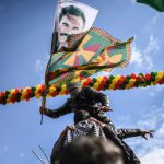 A Kurdish boy waves flags with a picture of jailed Kurdish leader Abdullah Ocalan. The event was organised by parties including the pro-Kurd Peoples’ Democratic Party (HDP), the third-largest party in the Turkish parliament