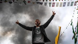 A Kurdish man shouts slogans as Turkish Kurds gather for Newroz celebrations for the new year in Diyarbakir, southeastern Turkey. But 13 HDP lawmakers, including its co-leaders, are in jail on charges of supporting Kurdish militants, accusations the party says were fabricated to prevent them from campaigning for a “no” vote