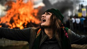 A Kurdish woman dances in front of a fire as Turkish Kurds gather for Newroz celebrations for the new year in Diyarbakir, southeastern Turkey. Newroz (also known as Nawroz or Nowruz) is an ancient Persian festival, which is also celebrated by Kurdish people, marking the first day of spring